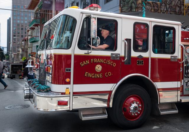 A fire truck driving through San Francisco