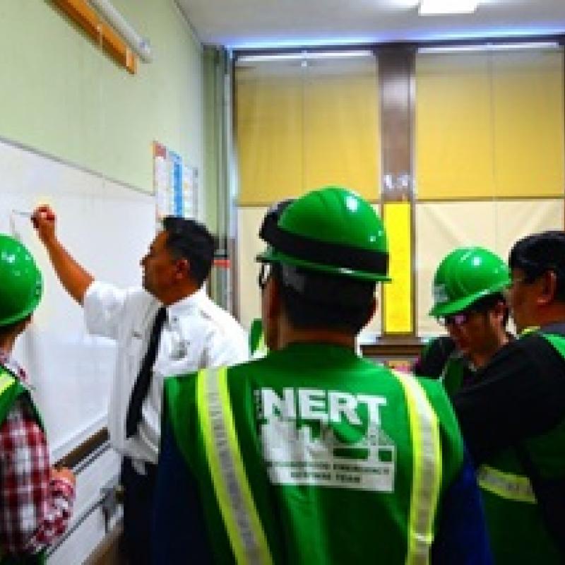NERT - image of NERT instructor teaching lesson plan to volunteers
